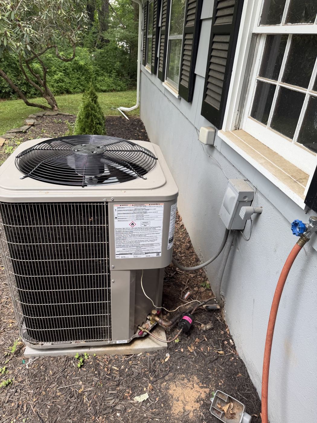 Bryant condenser with new refrigerant line set installed by Wayne's HVAC