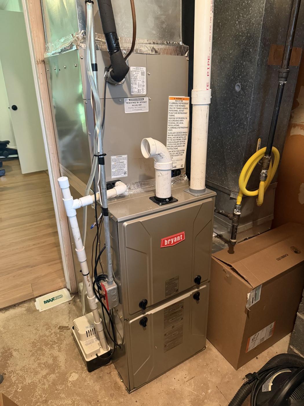 Bryant furnace and air handler installed by Wayne's HVAC in a basement utility room