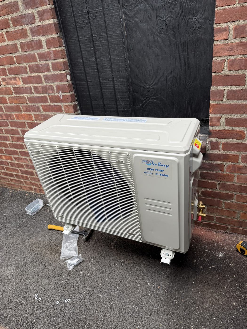 Ductless heat pump outdoor unit during installation by Wayne's HVAC
