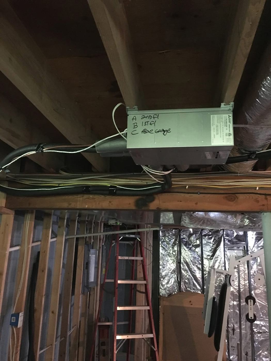 Mitsubishi multi-zone branch box labeled for three zones, installed by Wayne's HVAC