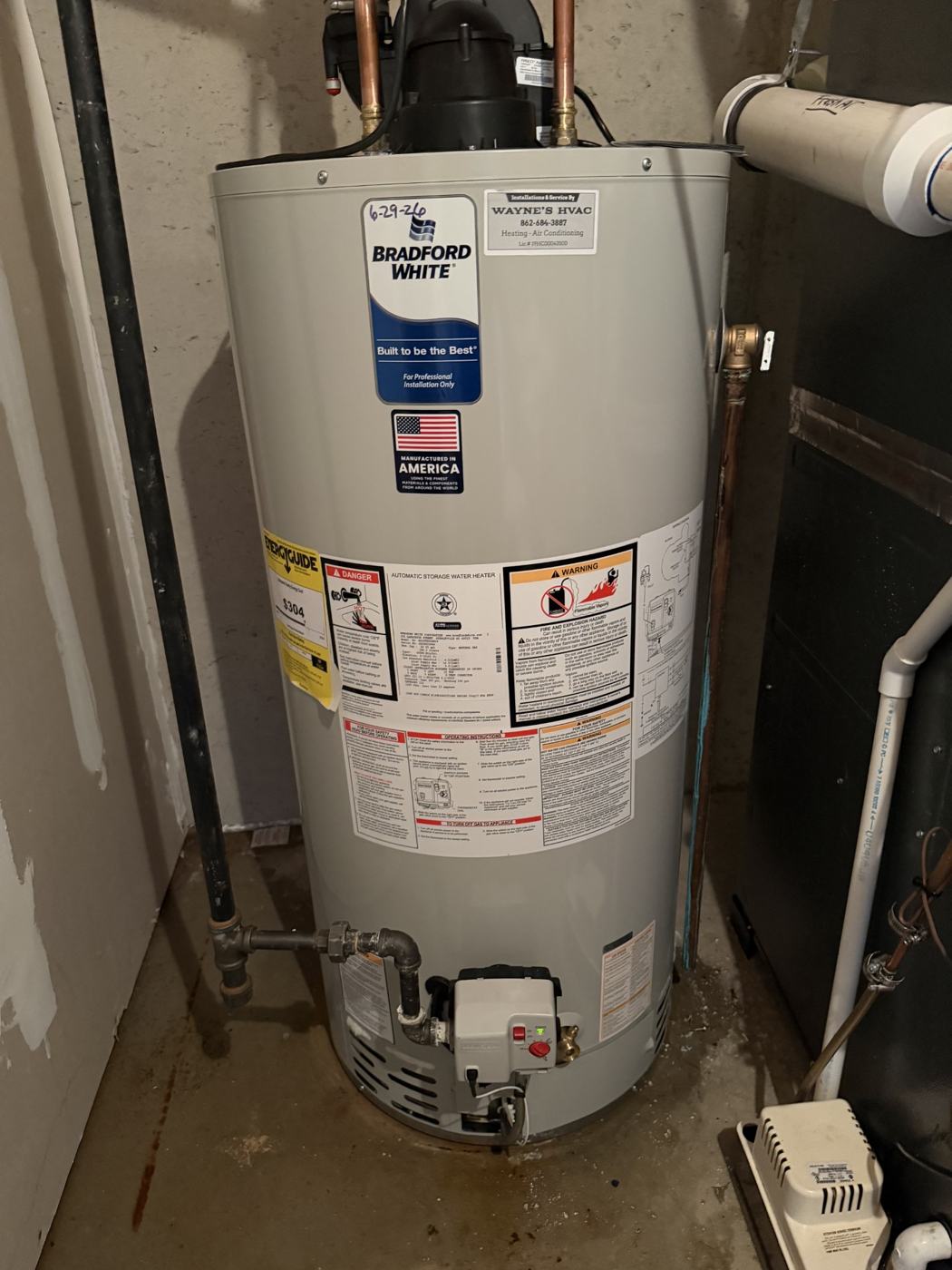 Bradford White water heater with a Wayne's HVAC installation sticker